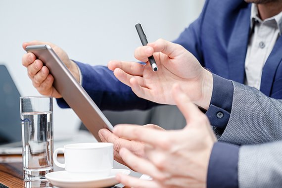 Two managers focused on their meeting in a boardroom